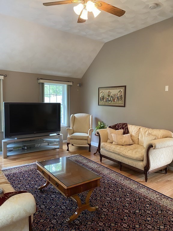 359 Concord Road Billerica, MA 01821 - Photo 17 of 35 a living room with furniture and a flat screen tv