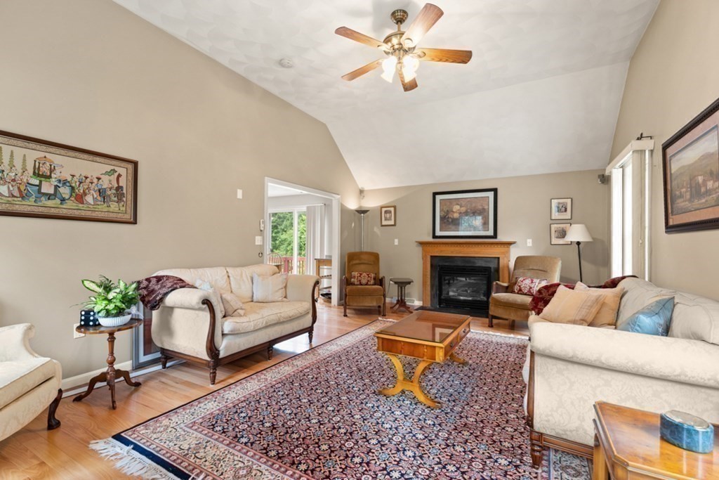 359 Concord Road Billerica, MA 01821 - Photo 18 of 35 a living room with furniture a fireplace and a table