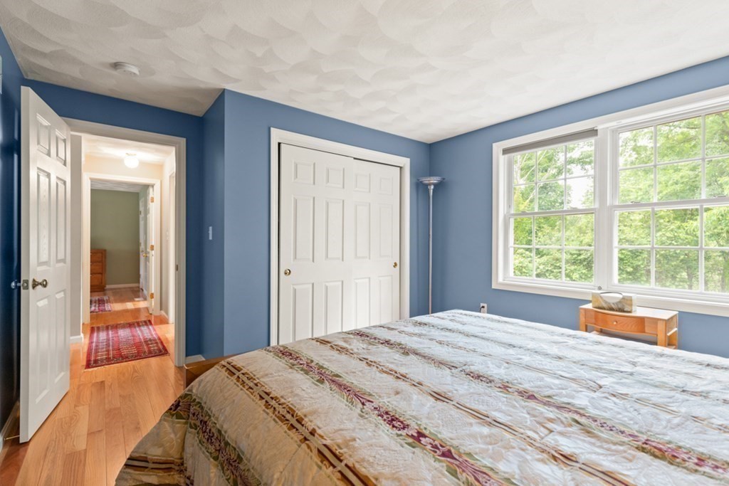 359 Concord Road Billerica, MA 01821 - Photo 29 of 35 a bedroom with a bed and large windows