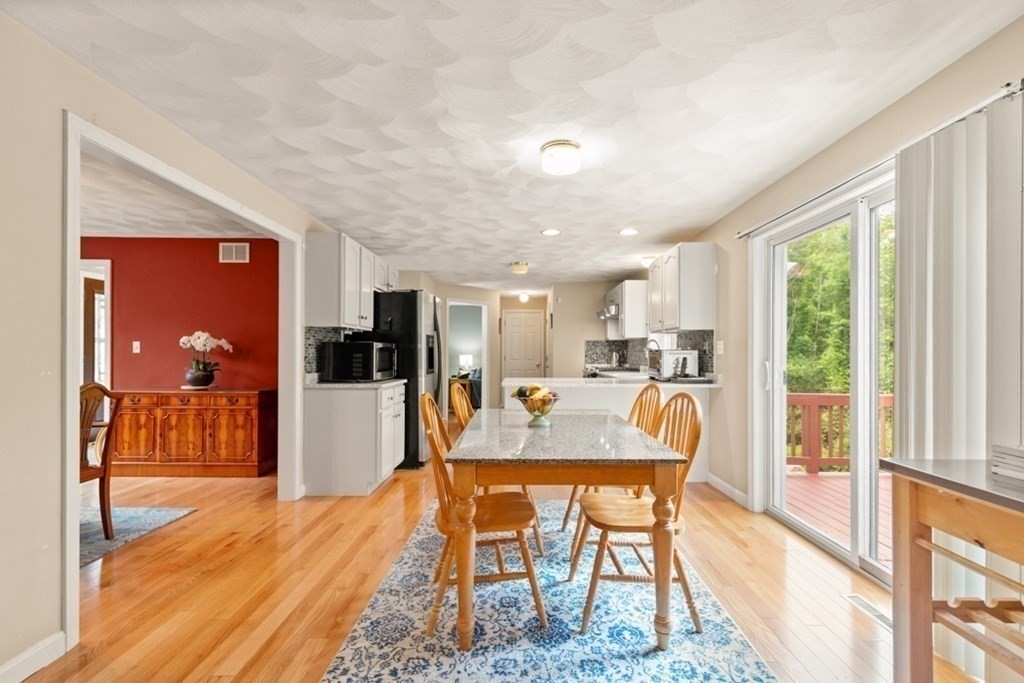 359 Concord Road Billerica, MA 01821 - Photo 9 of 35 a dining room with furniture and wooden floor