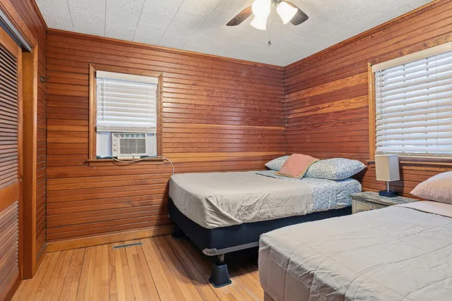 a bedroom with a large bed and a dresser