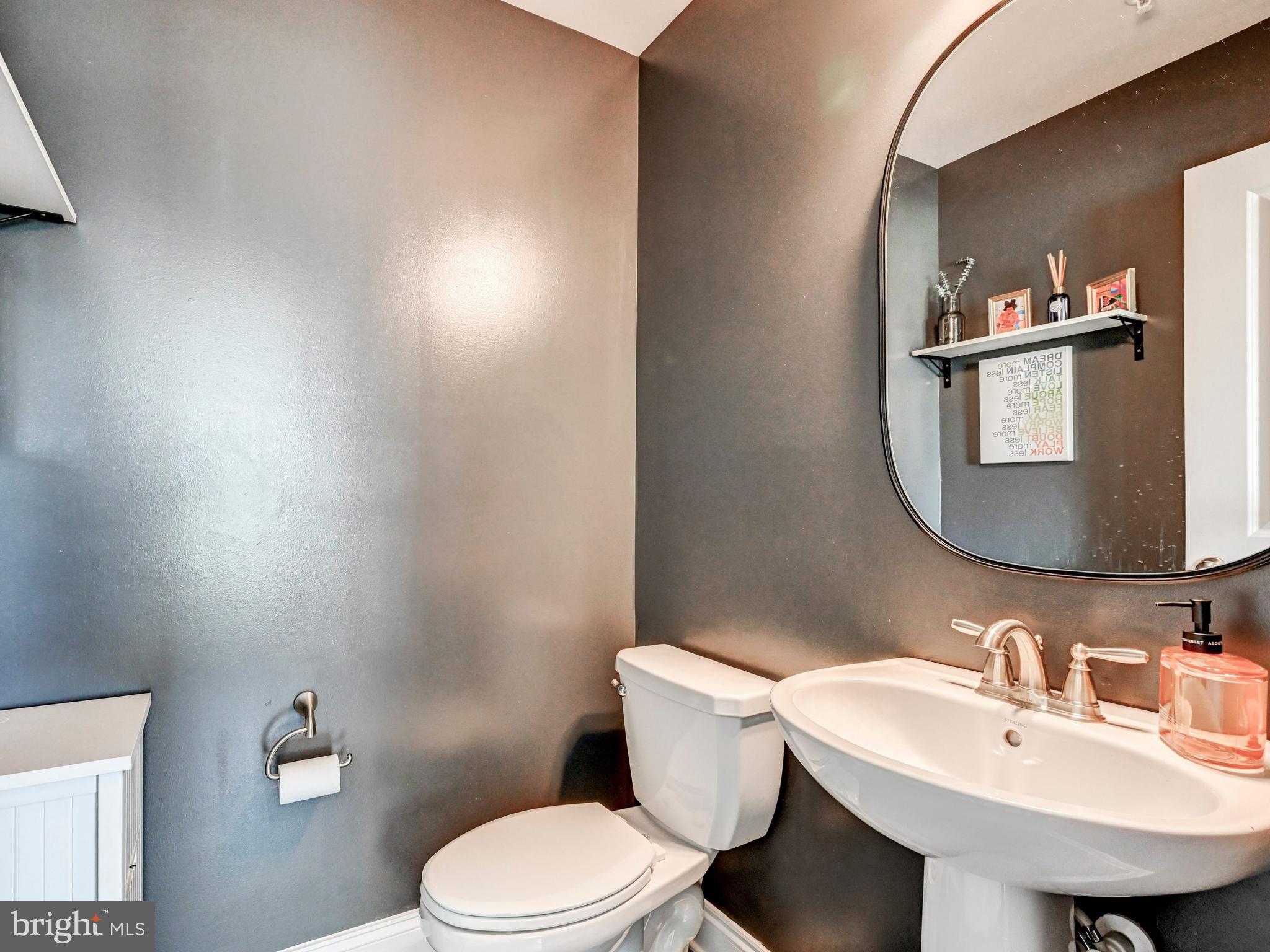 5000 John Buck Avenue Perry Hall, MD 21128 - Photo 17 of 41 a bathroom with a sink mirror and toilet