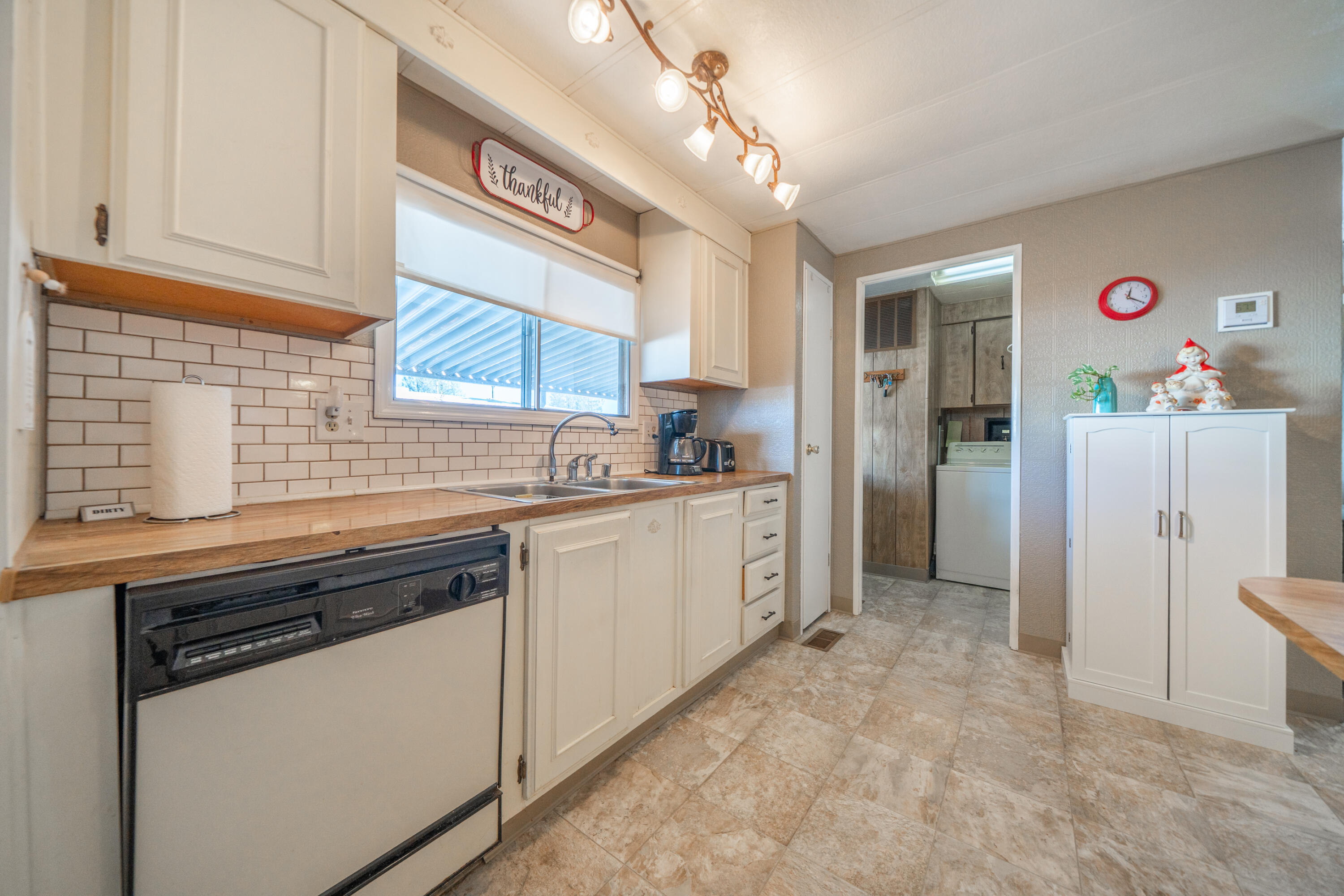 362 Lemon Drive, Unit 24 Redding, CA 96003 - Photo 20 of 44 a kitchen with a refrigerator a sink and cabinets