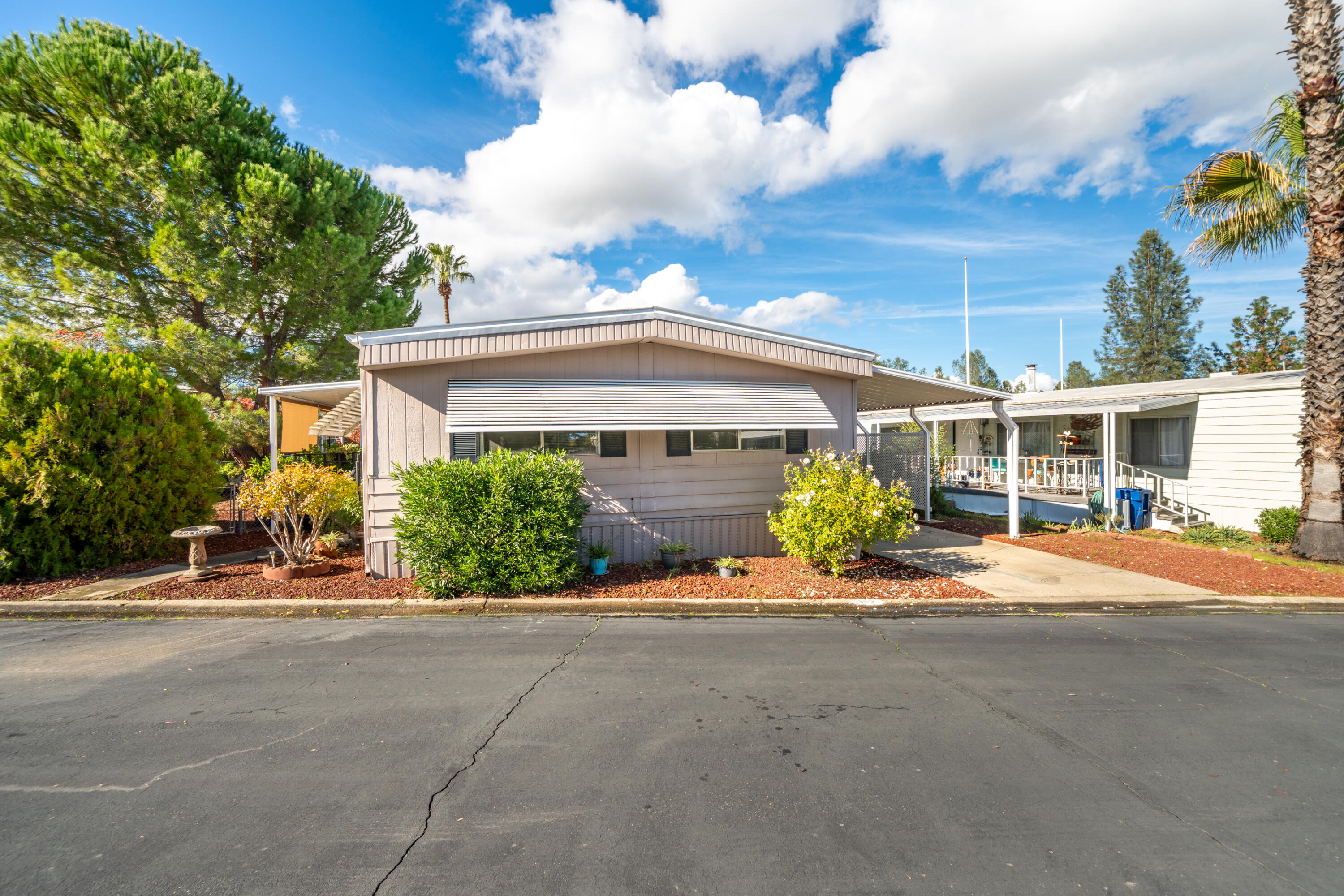 362 Lemon Drive, Unit 24 Redding, CA 96003 - Photo 2 of 44 a front view of house with yard and green space
