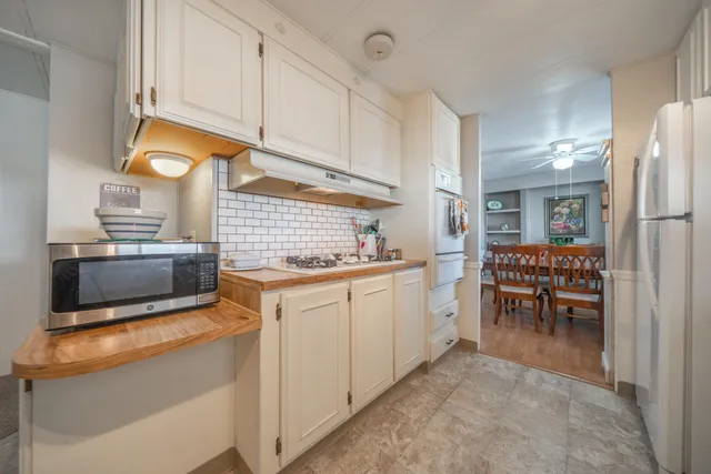 a kitchen with white cabinets