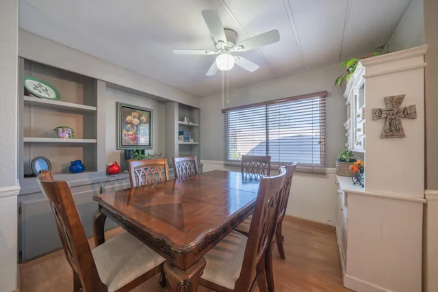 a bedroom with a bed and window with chair