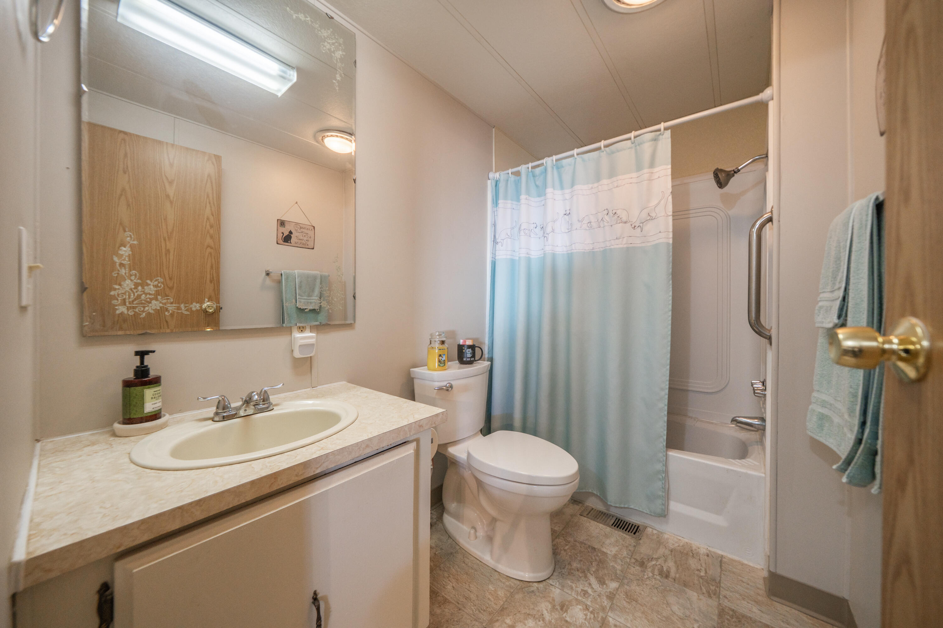 362 Lemon Drive, Unit 24 Redding, CA 96003 - Photo 26 of 44 a bathroom with a sink toilet and shower