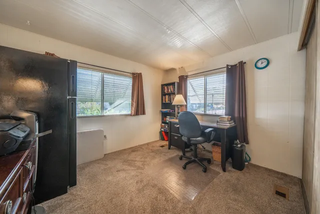a workspace with furniture and a window