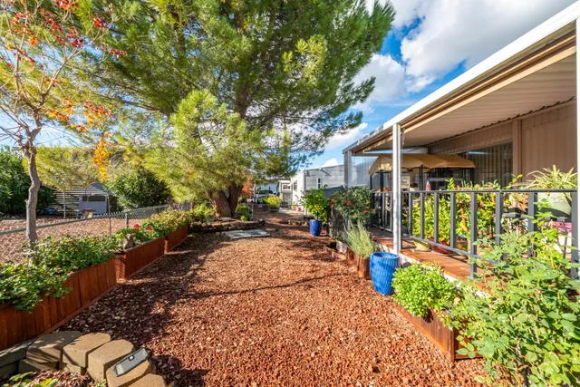 a view of a backyard with garden