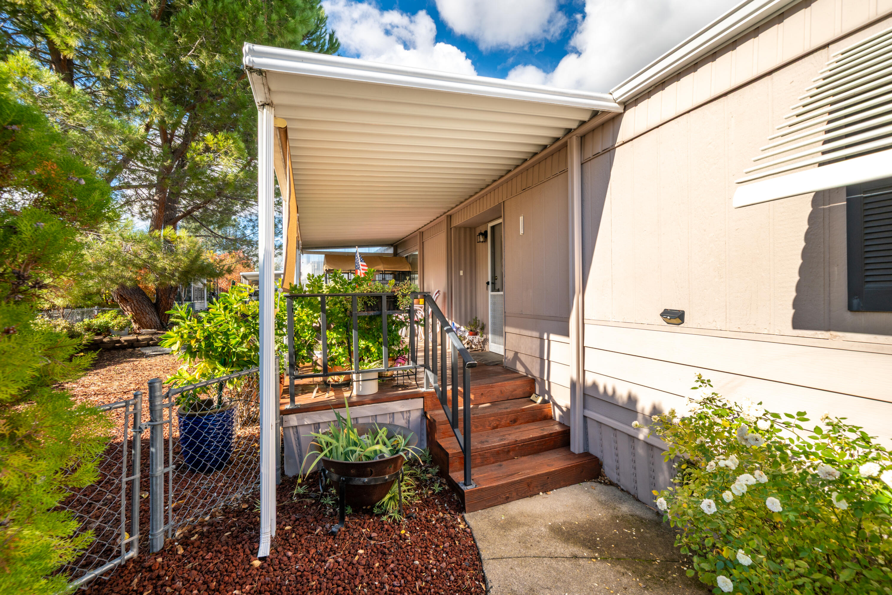 362 Lemon Drive, Unit 24 Redding, CA 96003 - Photo 8 of 44 a view of a porch with wooden floor and stairs