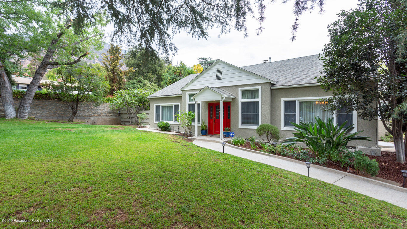 2556 Tanoble Drive Altadena, CA 91001 - Photo 2 of 44 a view of a house with a yard and potted plants