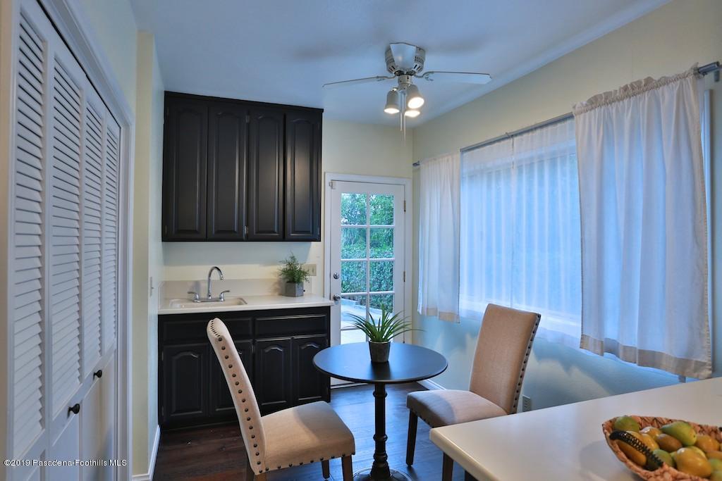 2556 Tanoble Drive Altadena, CA 91001 - Photo 11 of 44 a view of a dining room with furniture and chandelier