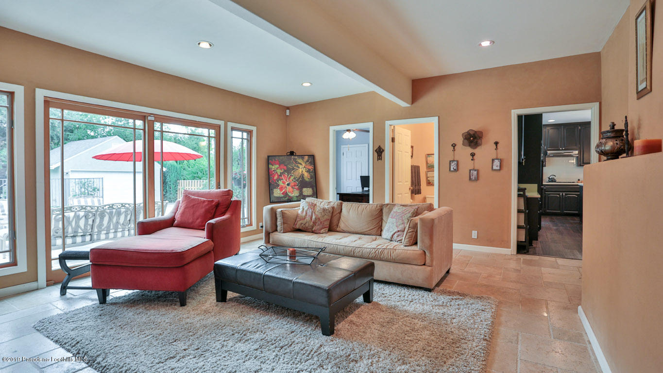 2556 Tanoble Drive Altadena, CA 91001 - Photo 14 of 44 a living room with furniture and a large window