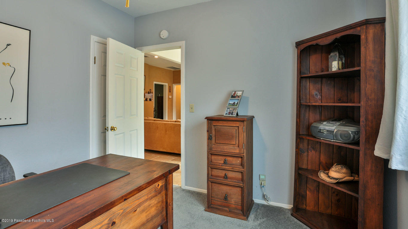 2556 Tanoble Drive Altadena, CA 91001 - Photo 16 of 44 a kitchen with a wooden floor and cabinets