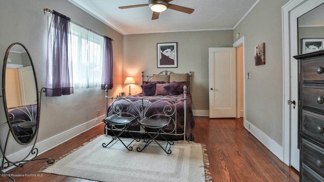 2556 Tanoble Drive Altadena, CA 91001 - Photo 22 of 44 a living room with furniture a window and a flat screen tv
