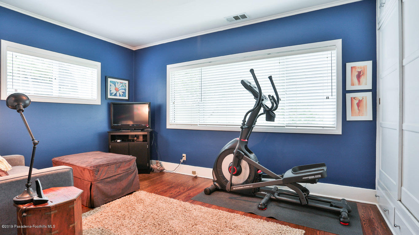 2556 Tanoble Drive Altadena, CA 91001 - Photo 24 of 44 a room with furniture a flat screen tv and a window