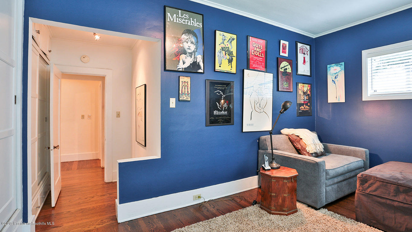 2556 Tanoble Drive Altadena, CA 91001 - Photo 25 of 44 a room with furniture and wooden floor