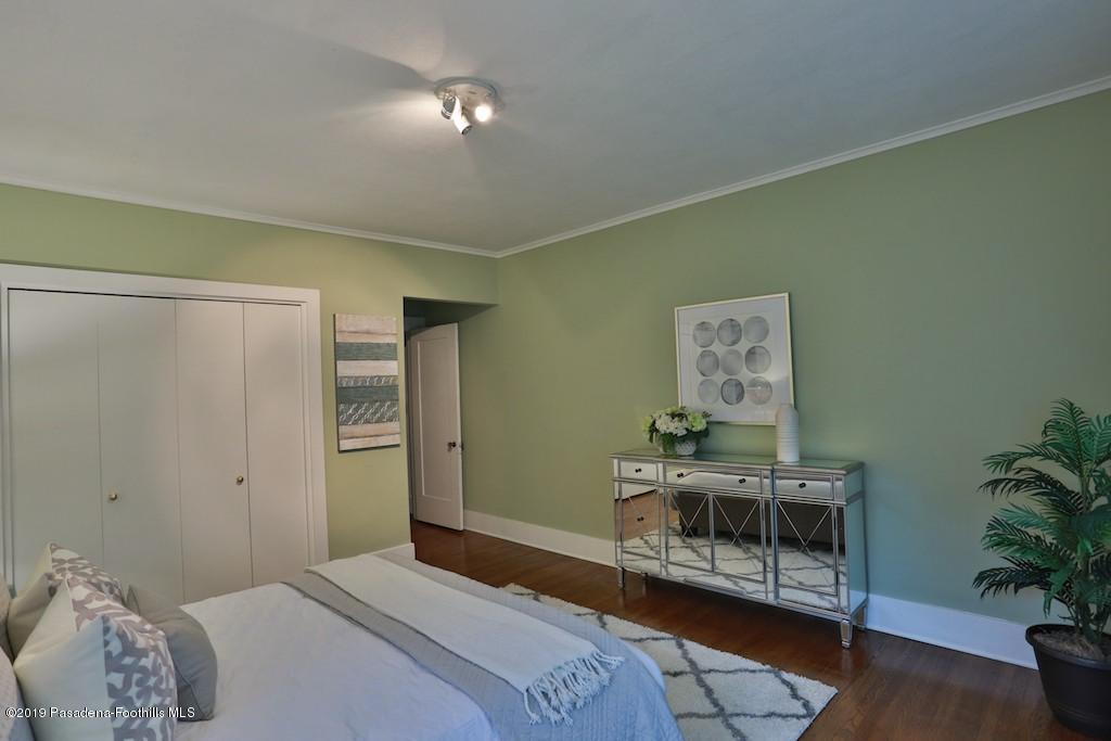2556 Tanoble Drive Altadena, CA 91001 - Photo 30 of 44 a bedroom with a bed and wooden floor
