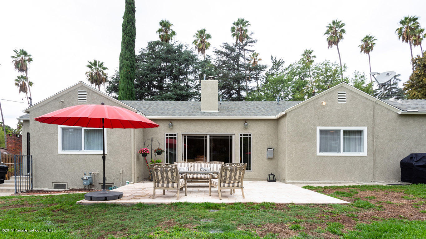 2556 Tanoble Drive Altadena, CA 91001 - Photo 33 of 44 a view of a chair and table in backyard of the house