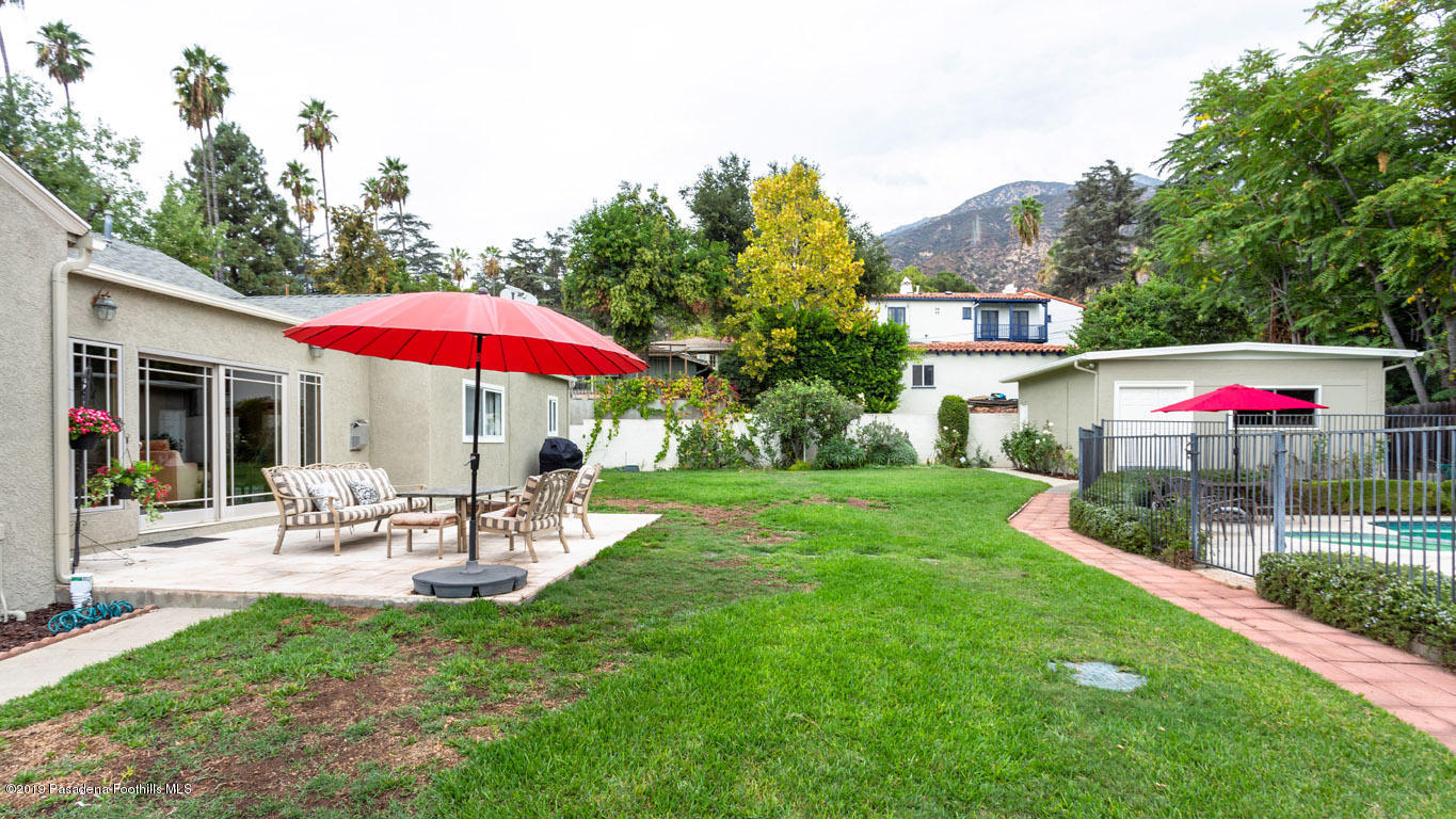 2556 Tanoble Drive Altadena, CA 91001 - Photo 34 of 44 a view of a house with backyard sitting area and garden