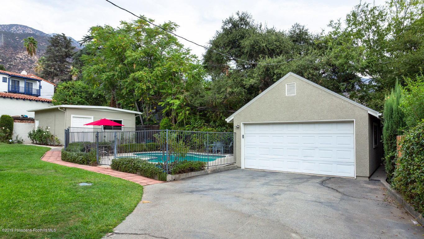 2556 Tanoble Drive Altadena, CA 91001 - Photo 35 of 44 a yellow and red white white house with a white fence