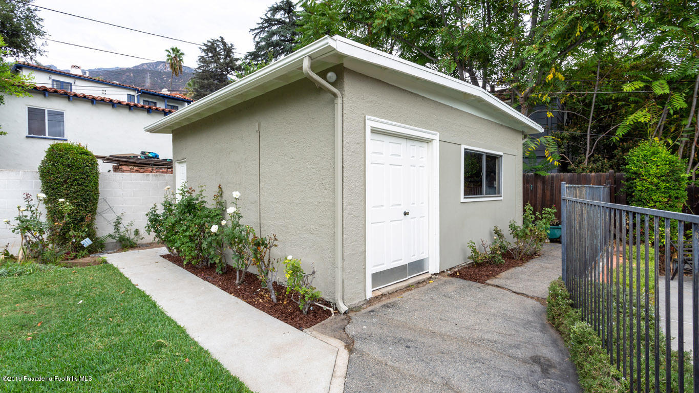 2556 Tanoble Drive Altadena, CA 91001 - Photo 40 of 44 a white house with a small yard plants