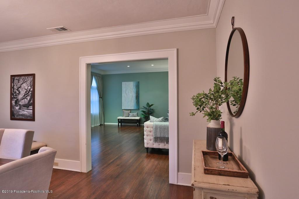 2556 Tanoble Drive Altadena, CA 91001 - Photo 5 of 44 a living room with furniture and a potted plant