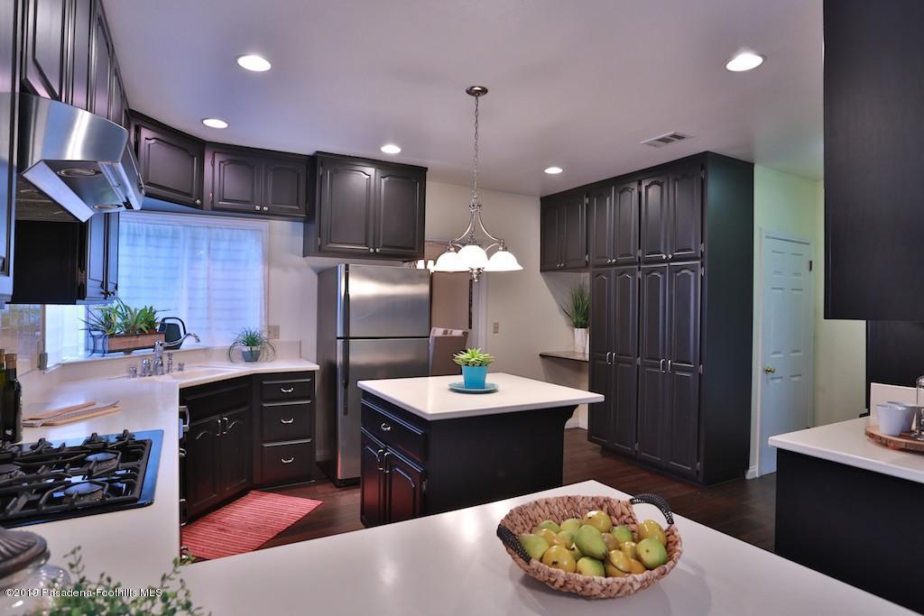 2556 Tanoble Drive Altadena, CA 91001 - Photo 10 of 44 a kitchen with a sink refrigerator and microwave