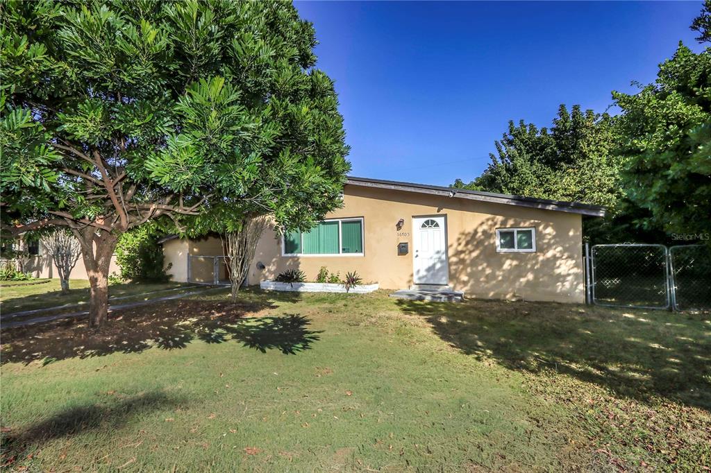 16705 Southwest 298th Terrace Homestead, FL 33030 - Photo 2 of 26 a view of a house with backyard and a tree