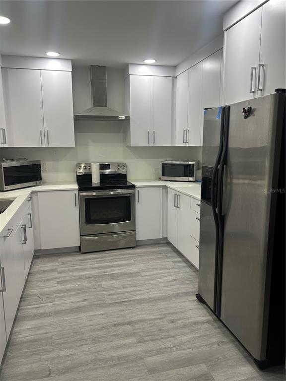 16705 Southwest 298th Terrace Homestead, FL 33030 - Photo 25 of 26 a kitchen with a sink stainless steel appliances and cabinets
