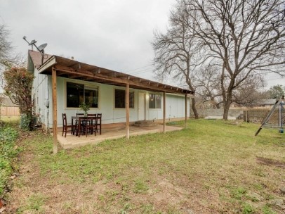6601 Ripple Run Austin, TX 78744 - Photo 22 of 22 a view of a house with patio and a garden