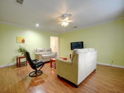 6601 Ripple Run Austin, TX 78744 - Photo 4 of 22 a living room with furniture and a flat screen tv