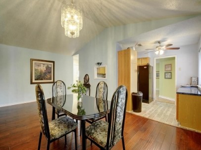 6601 Ripple Run Austin, TX 78744 - Photo 7 of 22 a view of a dining room with furniture and wooden floor
