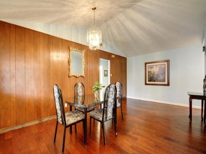 6601 Ripple Run Austin, TX 78744 - Photo 9 of 22 a view of a dining room with furniture wooden floor and chandelier