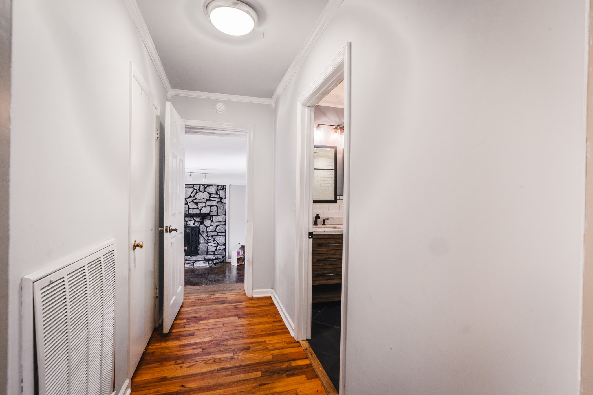 3953 Dry Fork Road Whites Creek, TN 37189 - Photo 29 of 68 a view of a hallway with wooden floor and a bathroom