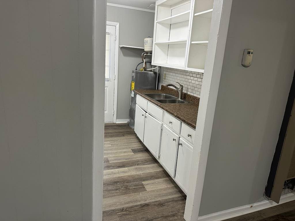 106 Porter Street Southwest Rome, GA 30161 - Photo 5 of 11 a kitchen with a stove and a refrigerator