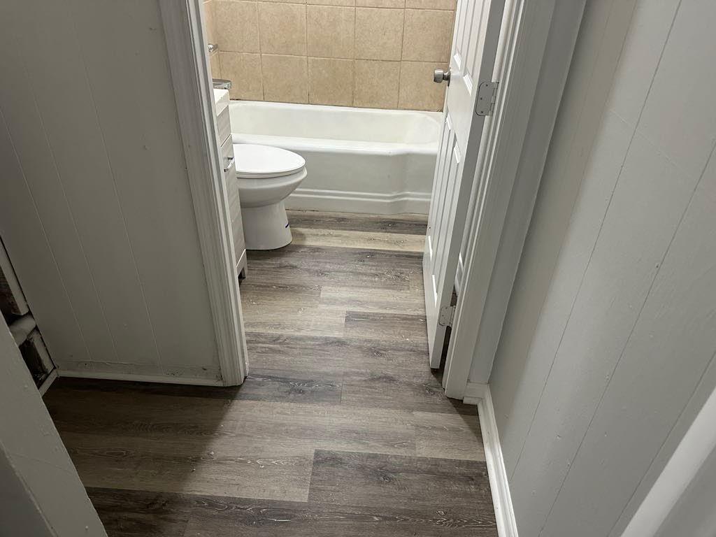 106 Porter Street Southwest Rome, GA 30161 - Photo 8 of 11 a bathroom with a toilet and a shower