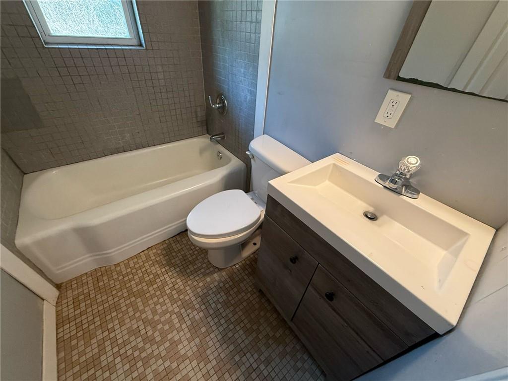 106 Porter Street Southwest Rome, GA 30161 - Photo 9 of 11 a bathroom with a sink toilet and shower