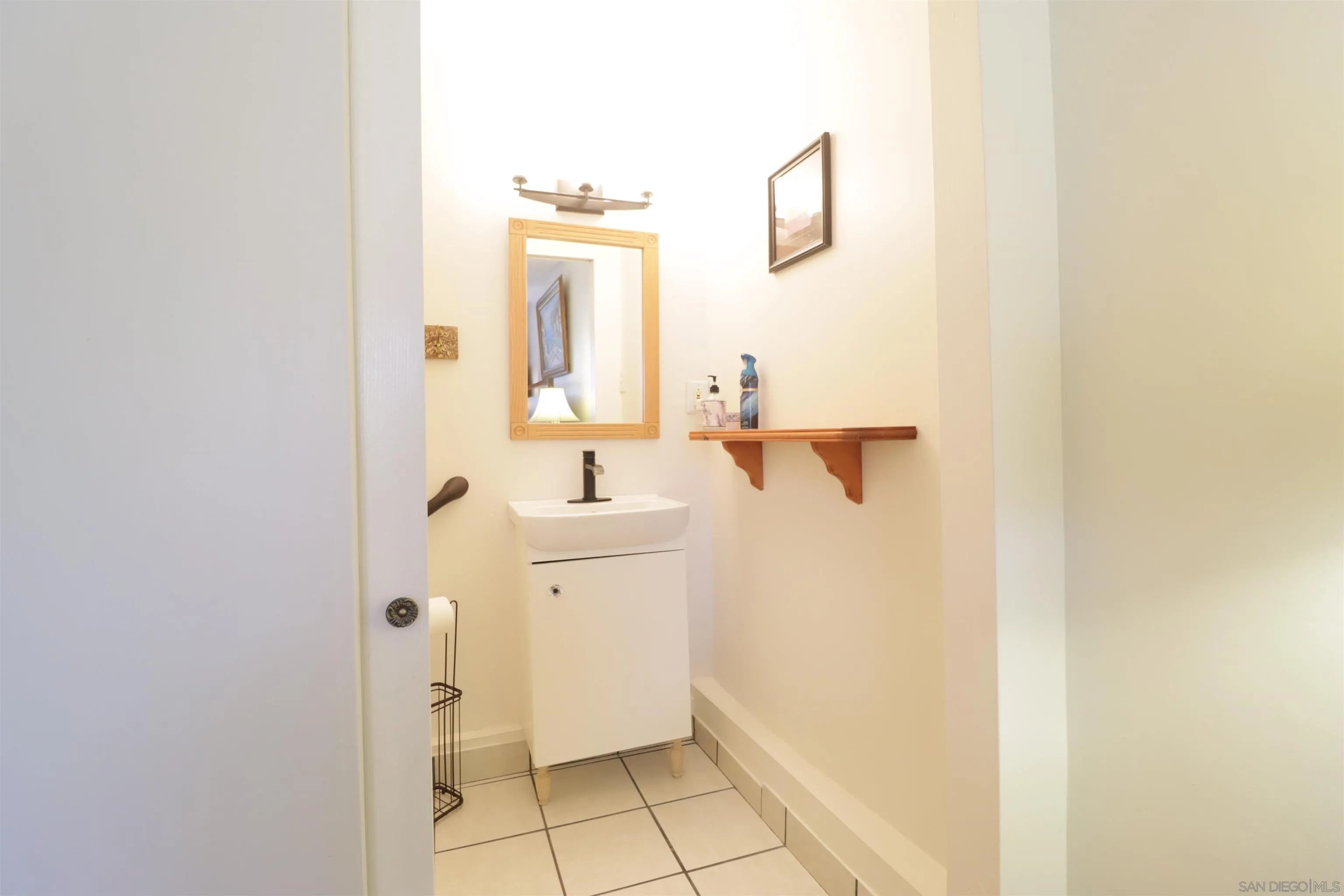 1233 Cresthill Road El Cajon, CA 92021 - Photo 11 of 50 a bathroom with a sink and mirror