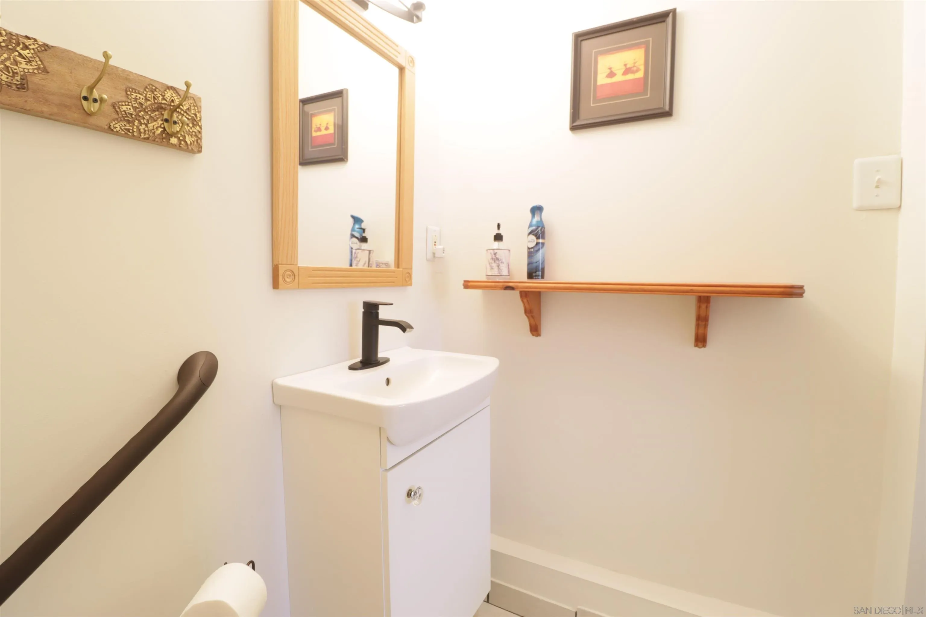 1233 Cresthill Road El Cajon, CA 92021 - Photo 12 of 50 a bathroom with a sink and a mirror