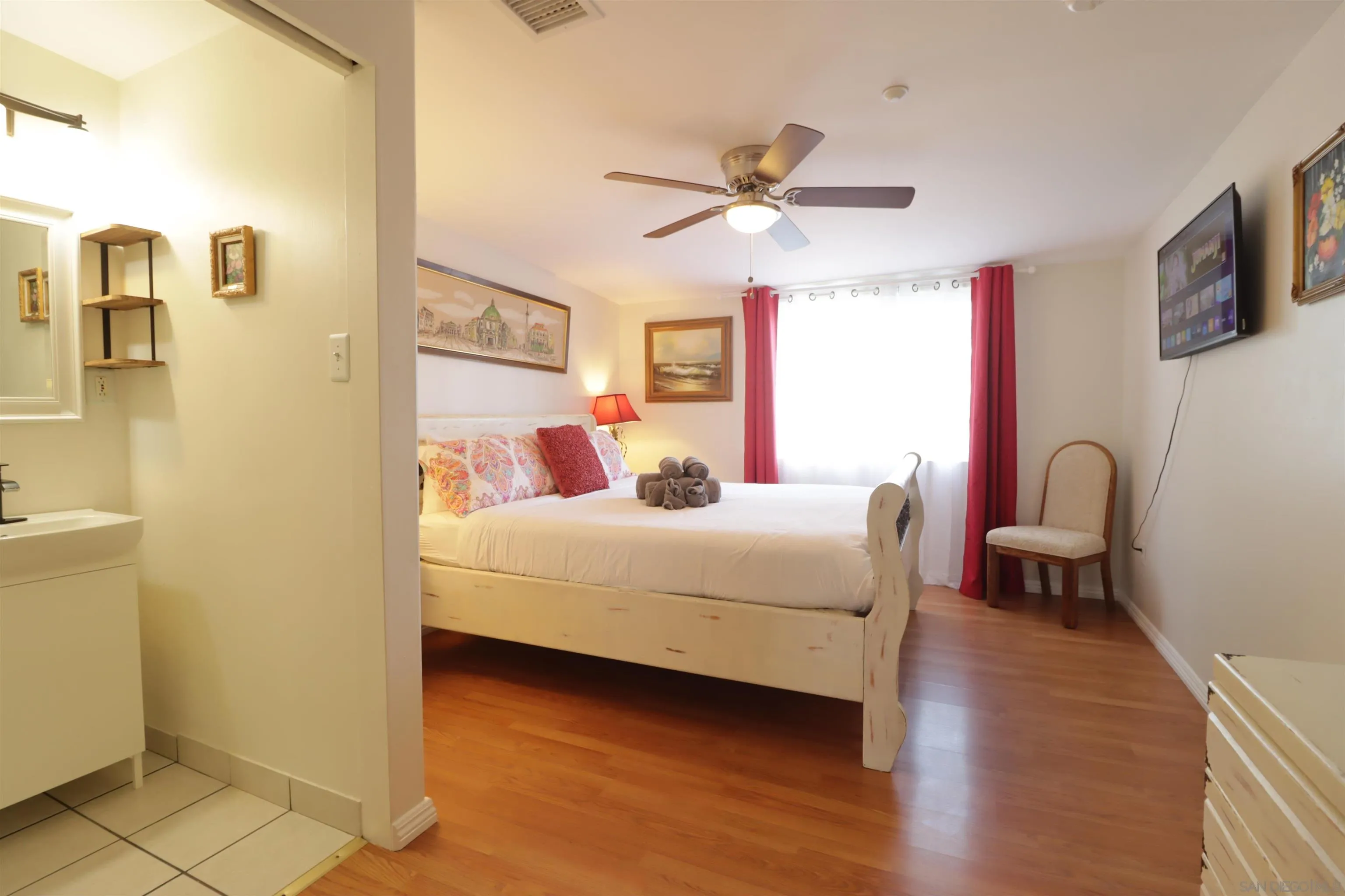 1233 Cresthill Road El Cajon, CA 92021 - Photo 13 of 50 a bedroom with a bed wooden floor and window