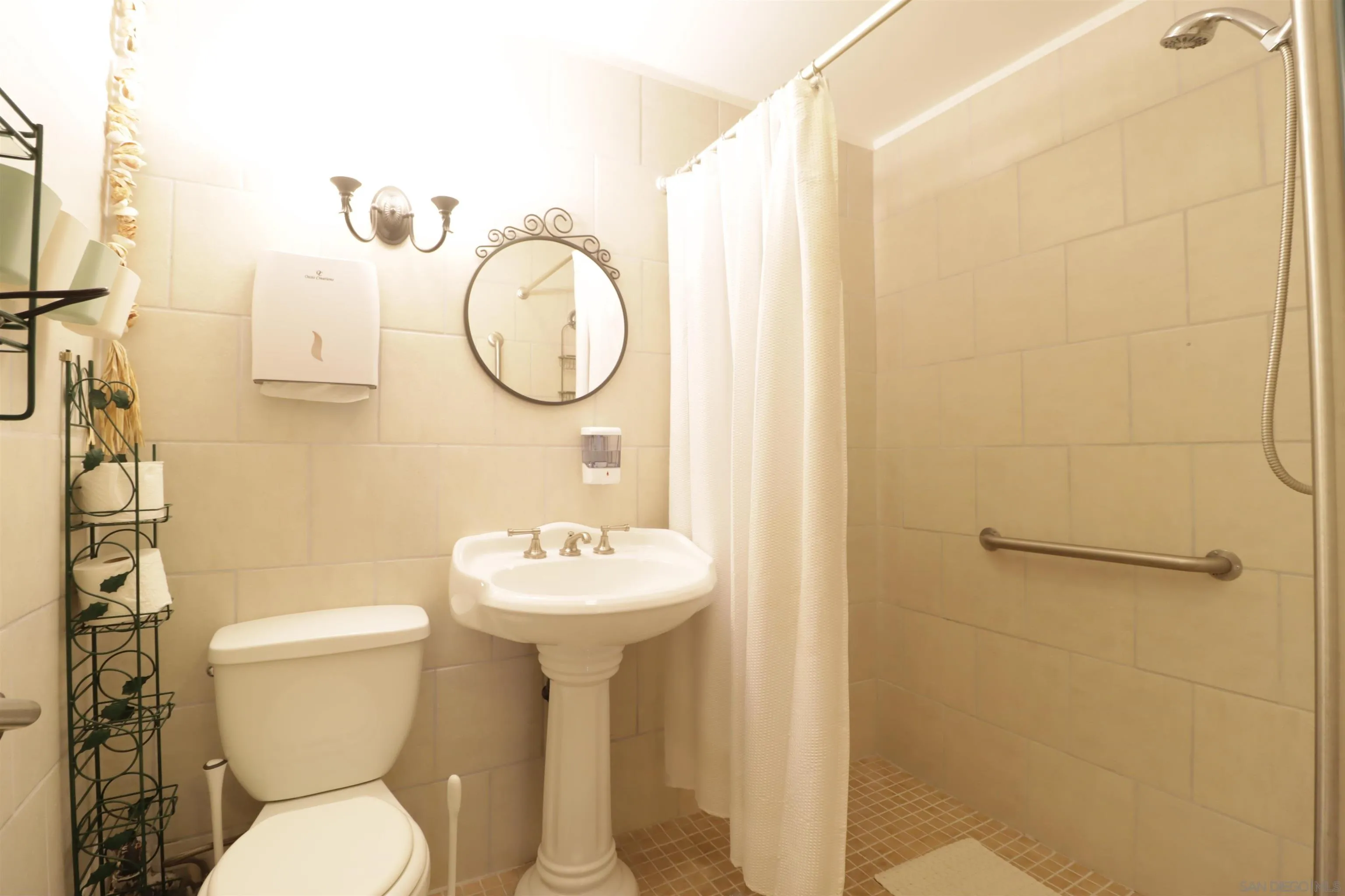 1233 Cresthill Road El Cajon, CA 92021 - Photo 18 of 50 a bathroom with a toilet sink and mirror