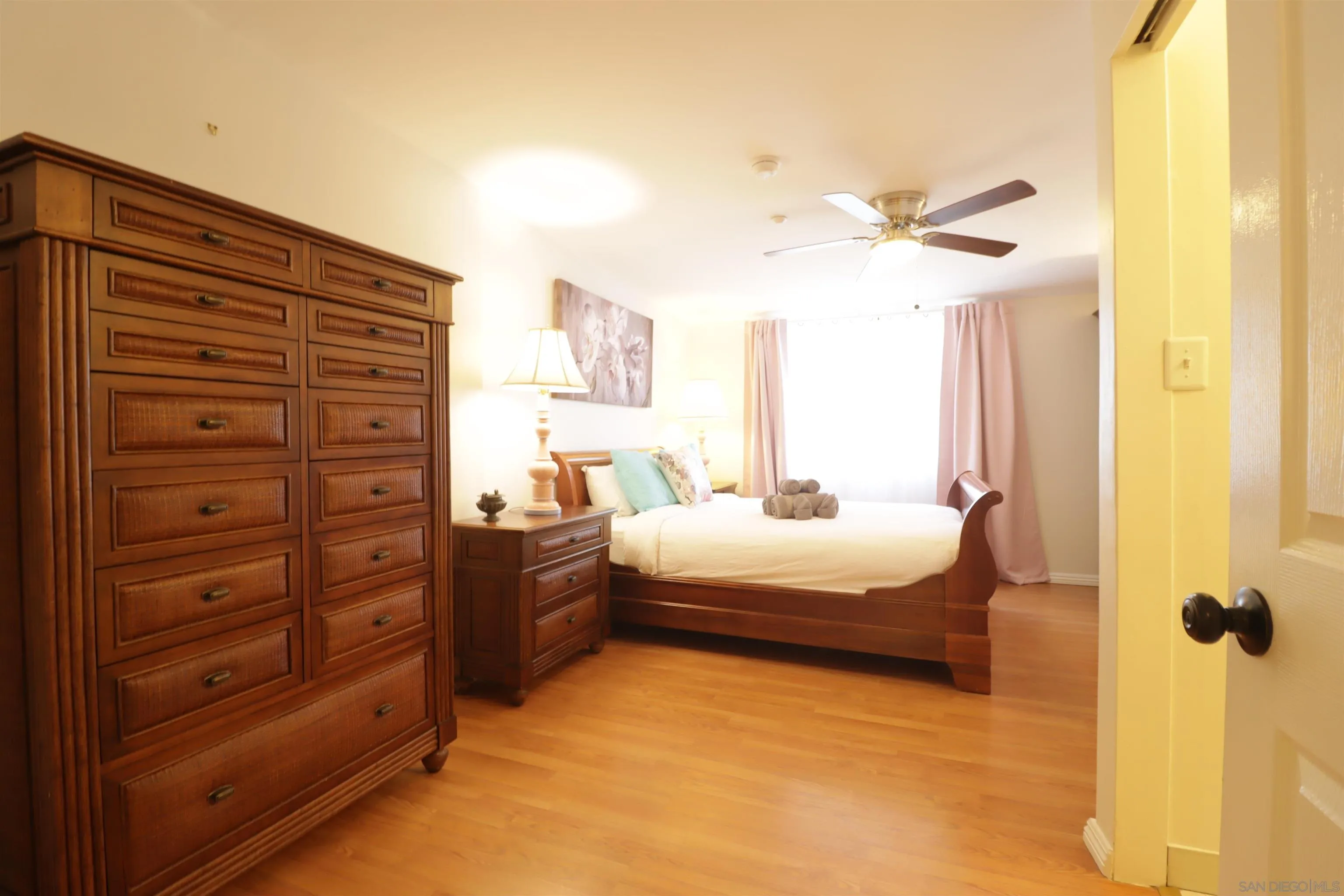 1233 Cresthill Road El Cajon, CA 92021 - Photo 19 of 50 a bedroom with a bed and a chandelier