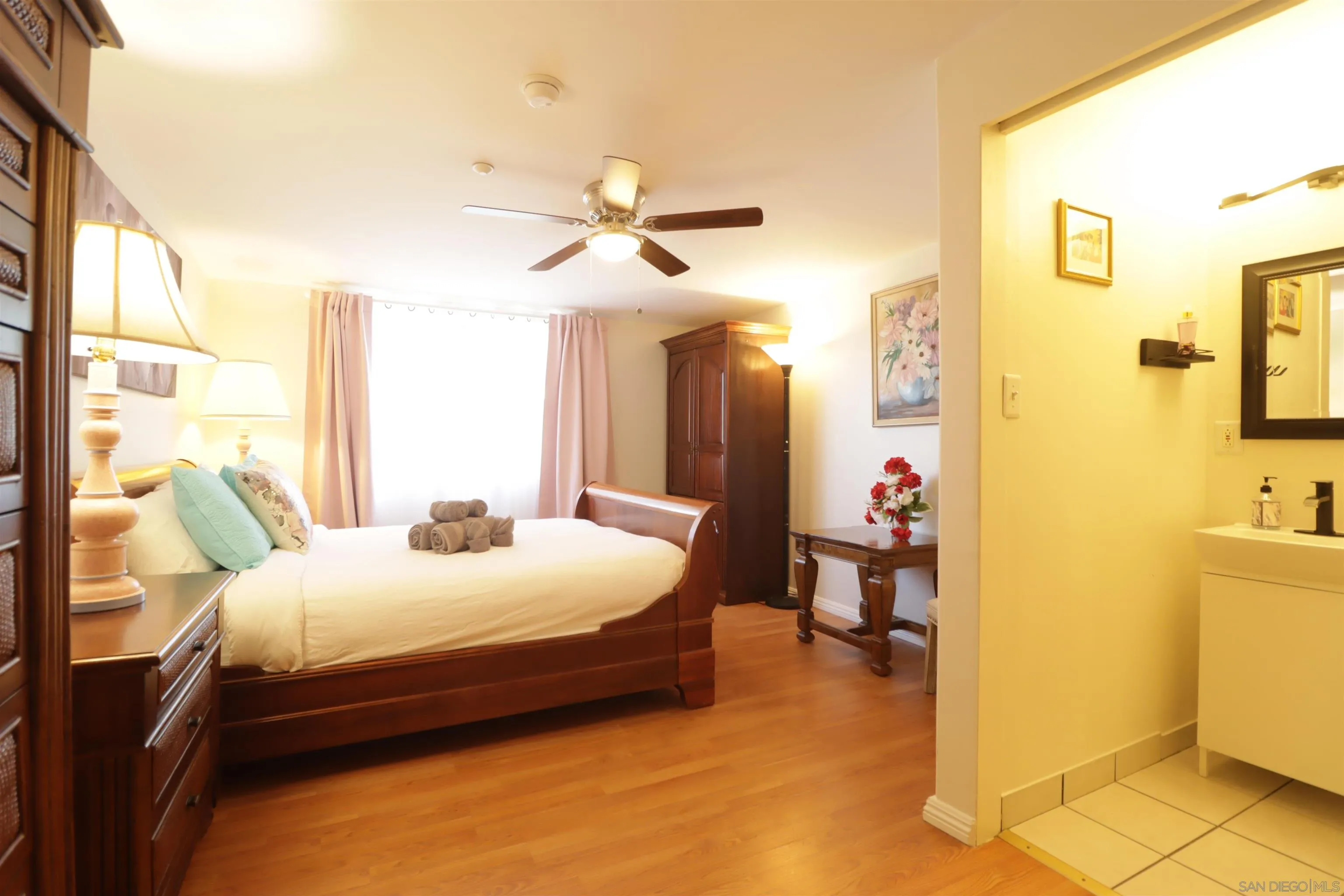 1233 Cresthill Road El Cajon, CA 92021 - Photo 20 of 50 a bedroom with a bed and a chandelier