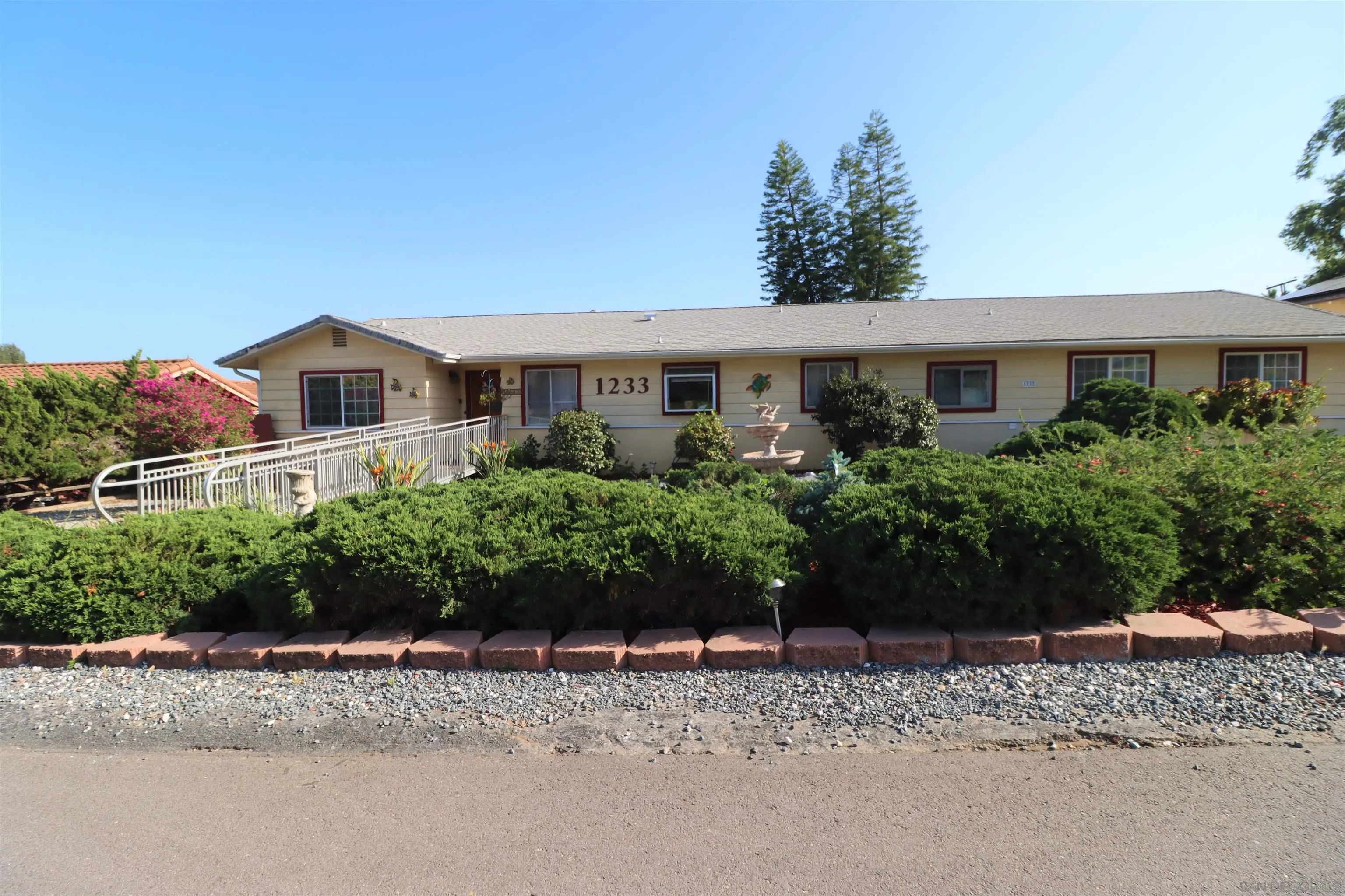 1233 Cresthill Road El Cajon, CA 92021 - Photo 2 of 50 a front view of a house with a yard and a garden