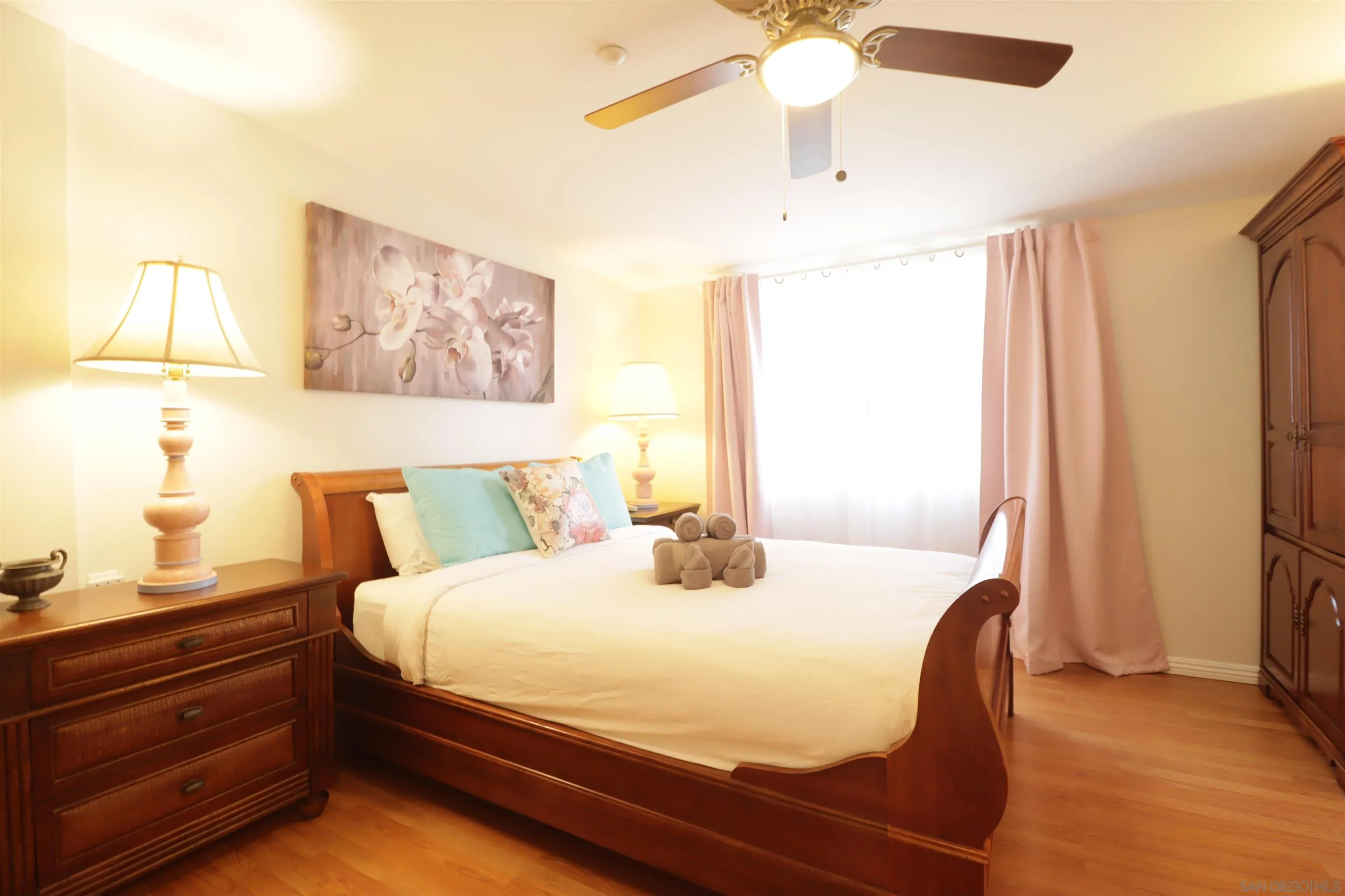 1233 Cresthill Road El Cajon, CA 92021 - Photo 21 of 50 a bedroom with a bed and a chandelier