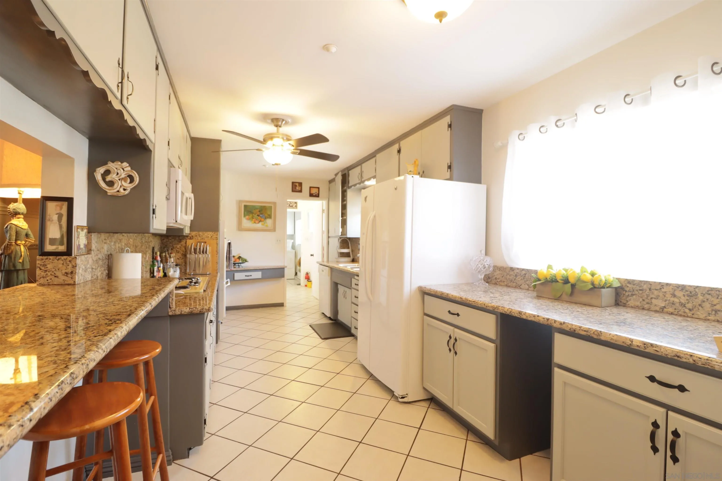 1233 Cresthill Road El Cajon, CA 92021 - Photo 26 of 50 a kitchen with stainless steel appliances granite countertop a refrigerator and a sink