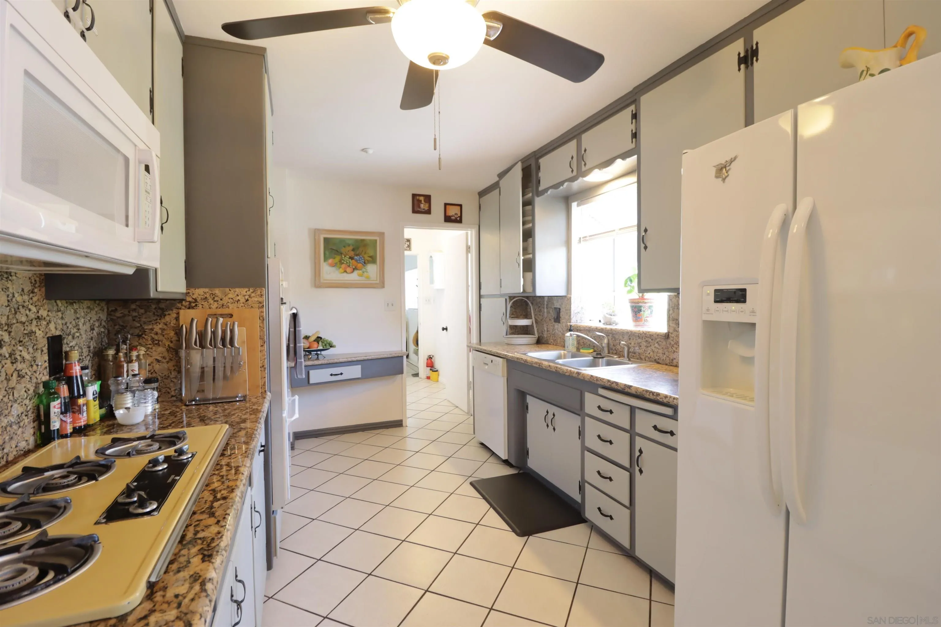 1233 Cresthill Road El Cajon, CA 92021 - Photo 27 of 50 a kitchen with stainless steel appliances a stove a sink and a refrigerator