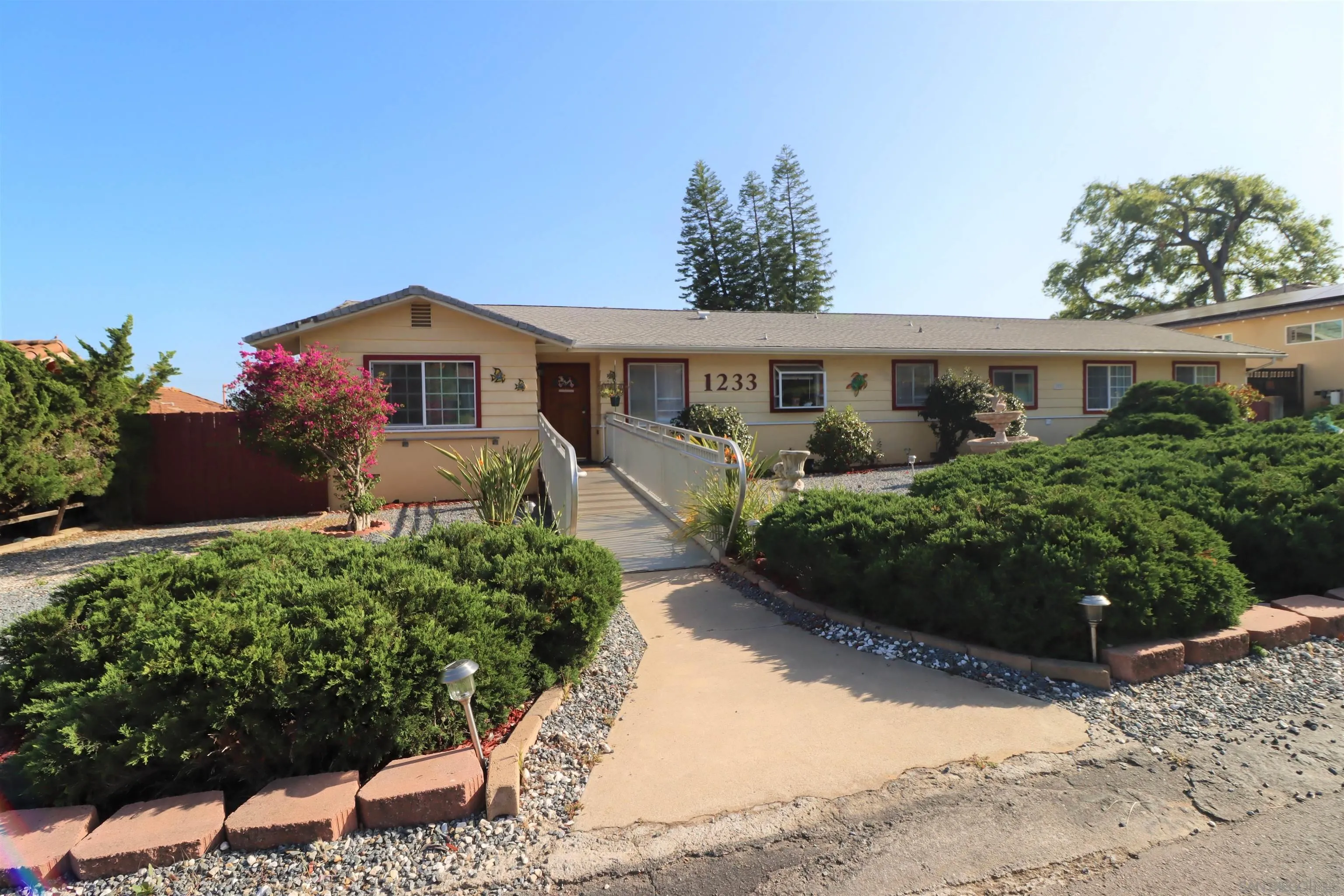 1233 Cresthill Road El Cajon, CA 92021 - Photo 3 of 50 a front view of a house with a yard