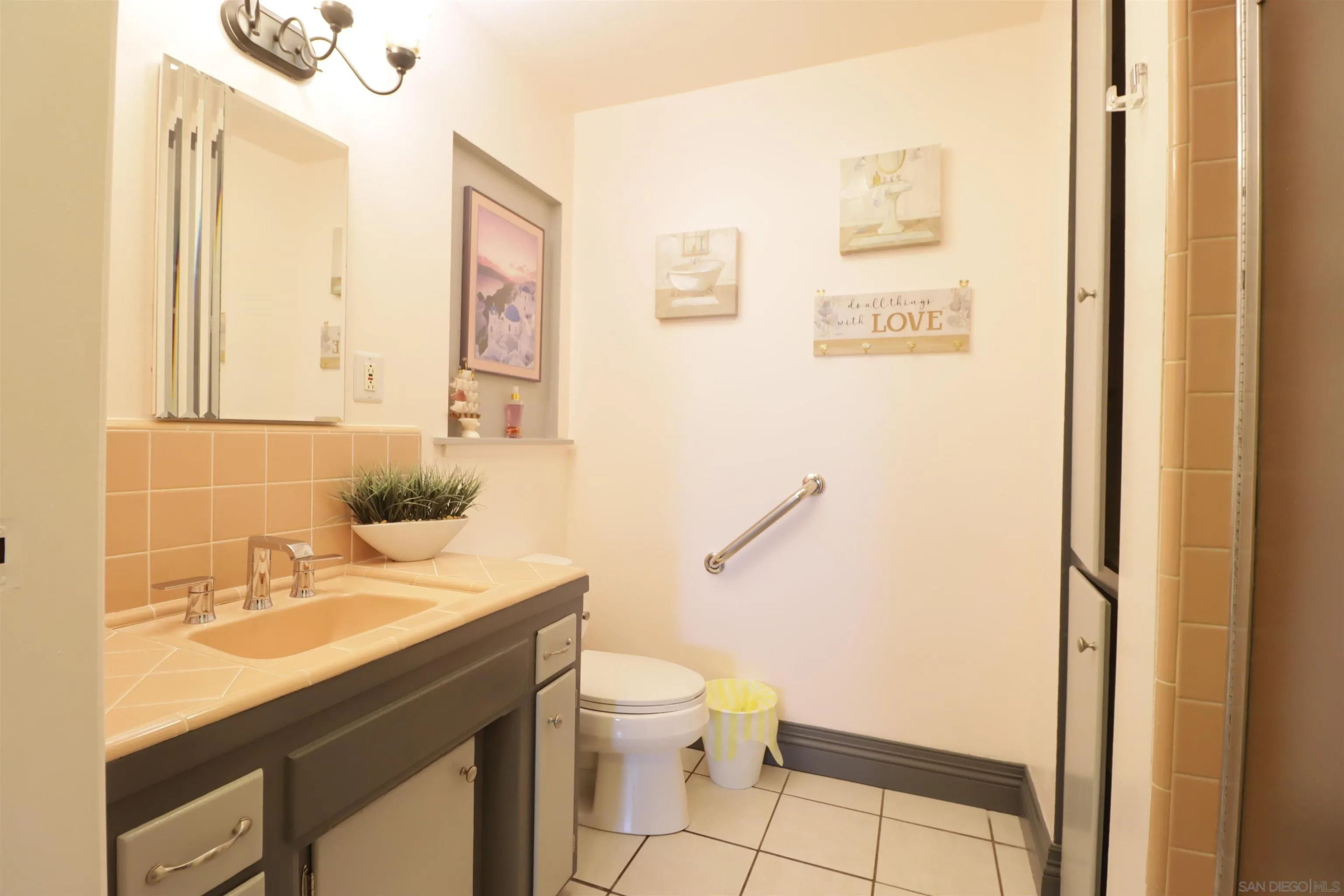 1233 Cresthill Road El Cajon, CA 92021 - Photo 35 of 50 a bathroom with a sink mirror vanity and toilet